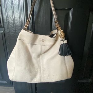Cream colored Coach bag